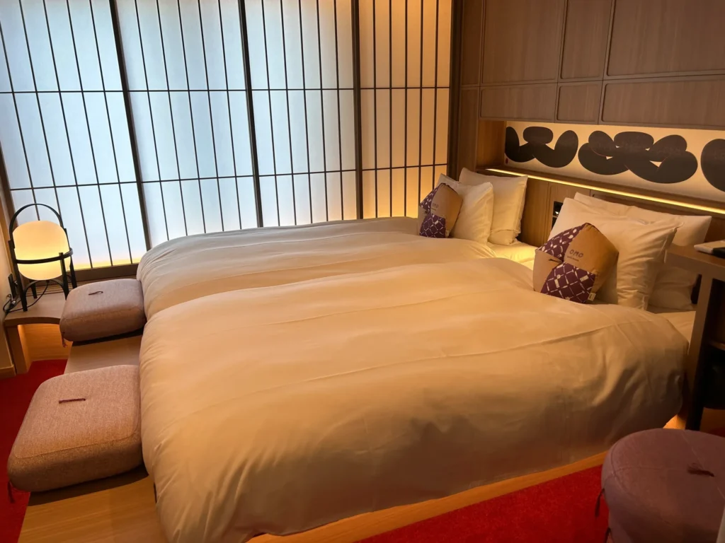 Twin room with shoji-inspired windows and warm wooden interiors at OMO3 Asakusa