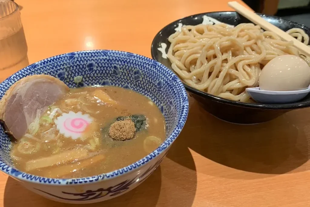 Rokurinsha tsukemen with thick noodles, seasoned egg, and rich dipping broth at Tokyo Ramen Street