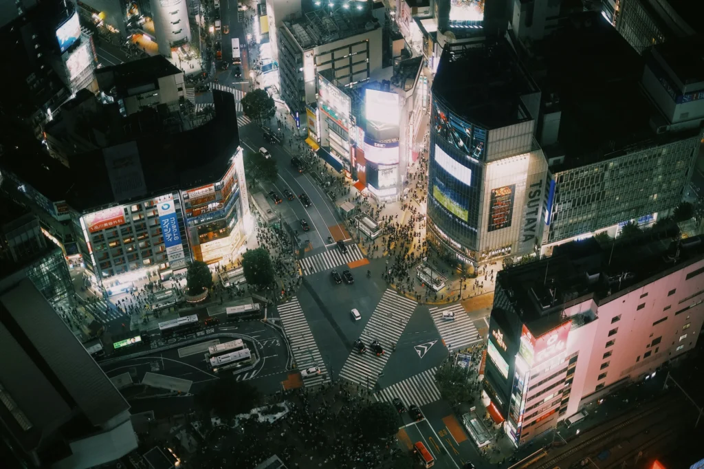Night view of Shibuya Crossing and surrounding illuminated buildings from above