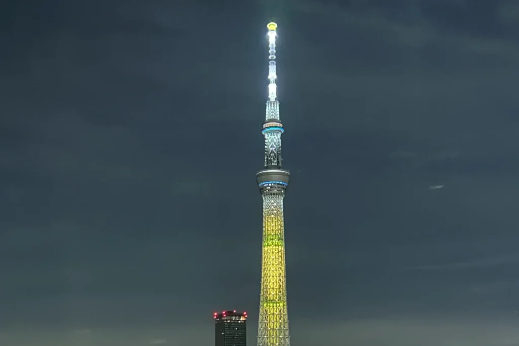 Illuminated Tokyo Skytree and the Asakusa cityscape at night viewed from OMO3 Asakusa