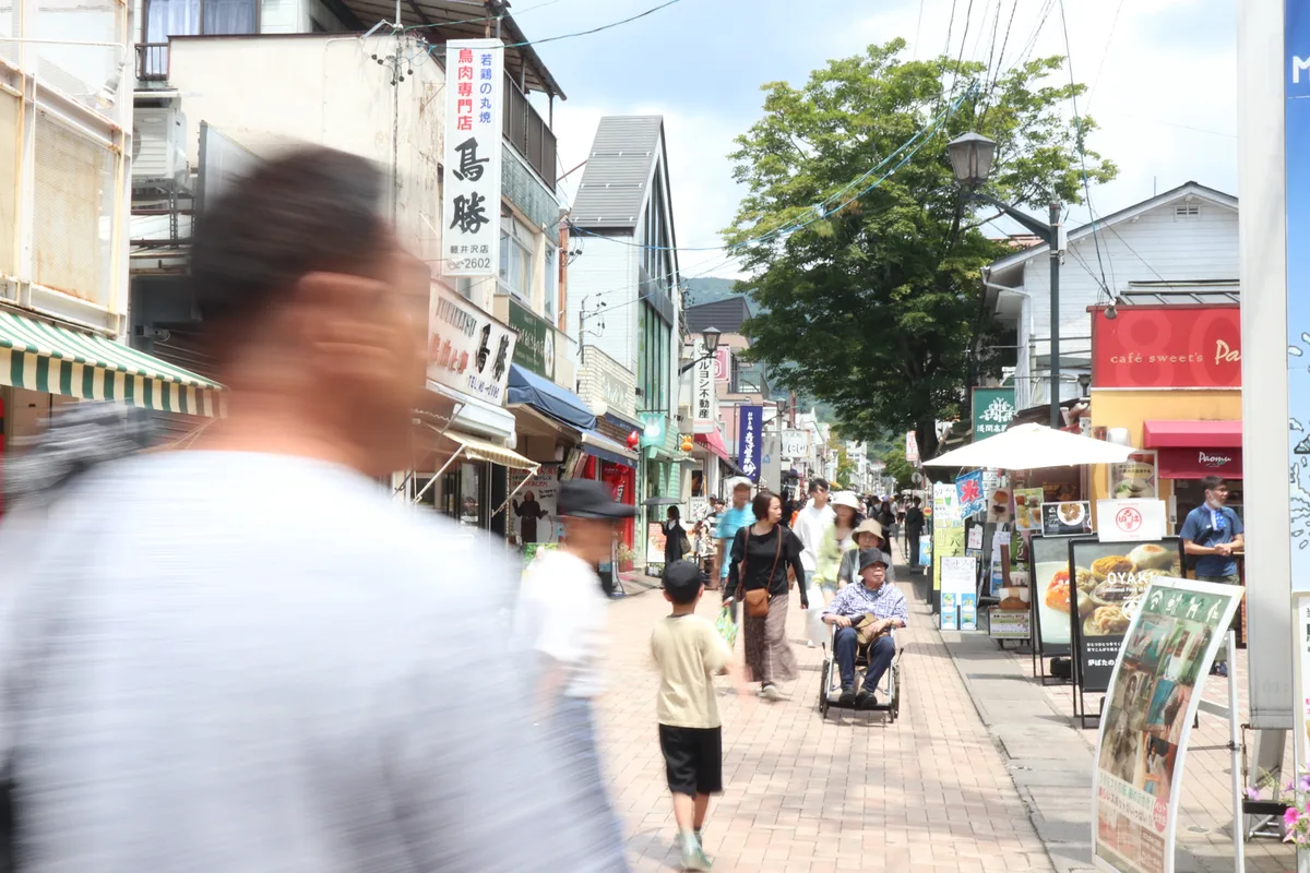 Street view of Kyu-Karuizawa Ginza Street with shops and visitors.