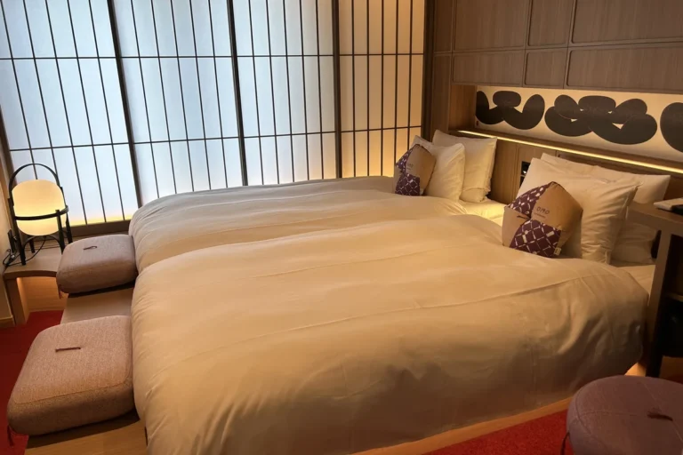 Bed and seating area inside a Tokyo hotel room