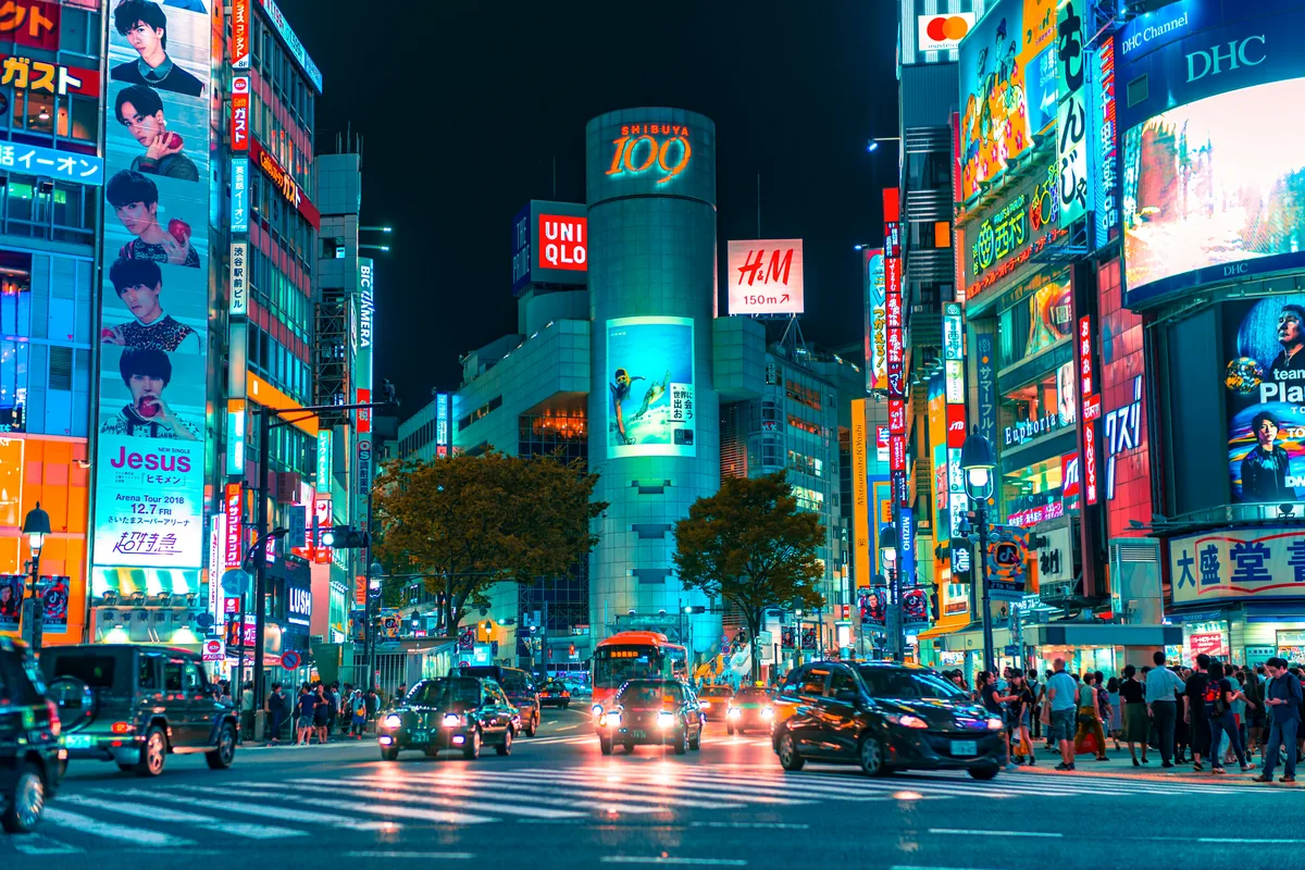 Illuminated streets and buildings in Shibuya at night